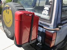 Gas can mounted to oem swing out carrier.