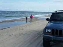 My beautiful wife and grandson checking out the beach.