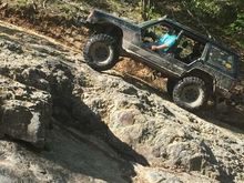 This is right about where I blew the PS line. I made it to the top of this slab and poured the rest of the fluid we had between us. I went over the speed limit the rest of this trail. PS went out about halfway down the decent. Once getting back to the camp I was able to fix it rather quickly. Hopefully you can tell how steep it is as the rear tires are holding the most weight.