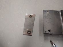 A piece of 3/16" with 2 nuts welded to it.