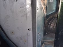With the inner fender notched, you can see it better. Immediately I wondered if these prepunched holes are specifically for what I am doing. I seriously considered drilling out these holes instead. But that means ai would have to trim my hood release, something I seriously did not want to do.