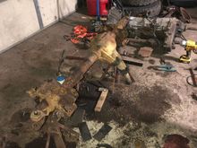 Disassembling the axle. Transmission and transfer case in the background. 