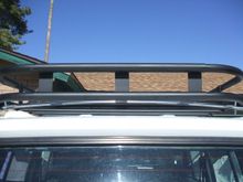 Done and painted. Now what to do with the spare? Spare tire mounting was the main reason behind our making the rack in the first place. Wracking (no pun intended) my brain to come up with something inexpensive, easy to use, and not overly complicated from a hardware standpoint.