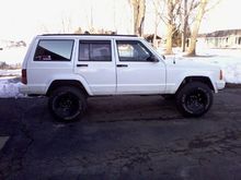This is with the tint and just replaced the 1 in rear lift blocks, (they were cracked in half!), with some heavy duty ones.  Unfortunately ordered the wrong size, 2 in, I was afraid this would make it "jacked up" in the back??  It looks ok, but not ideal, maybe level the front now?  At least it doesnt have the "jeep sag" anymore!