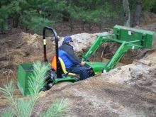 Me diggin' a 6' deep hole on the property with the JD. A little quality time and diesel fumes!