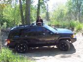 senior pic.. you can kinda see the exhaust... kinda looks bad cause im sittin on the burm on our track