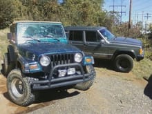 Gray Ghost next to xj6's wrangler.. bought the chief after this photo