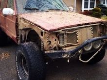 Stripped the front end to see what damage had been done. Header panel, bezel, signals and headlight of course. Fender, shot, but salvageable at the moment. Rad support needed to be pulled forward. Future concern will be the bumper.