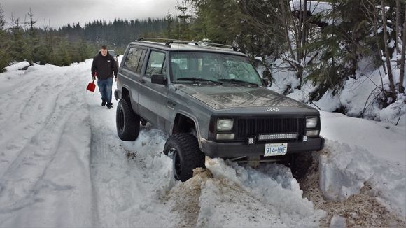 The snow was a bit much haha, old snow that was super icy and thick. Rut sucked me off the road. My buddy bringing the shovel to help get my stuck ass out!