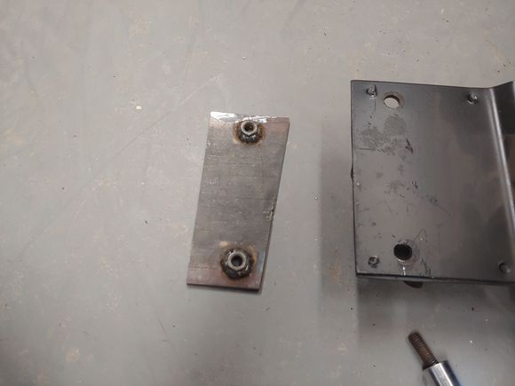 A piece of 3/16" with 2 nuts welded to it.