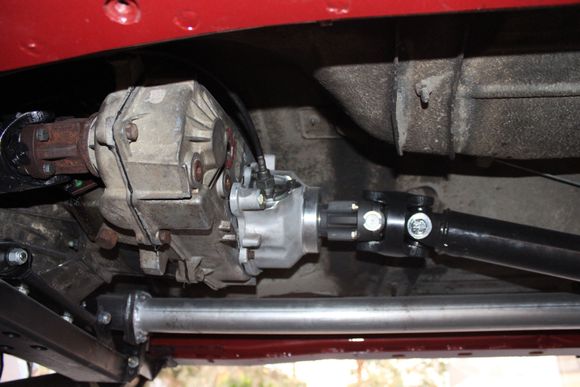 Slip yoke eliminator kit, new shift selector plate, 4WD linkage fabrication, shortened driveshaft, correct speedo calibration set up all done by M.I.T in El Cajon. I added 2 degree shims for the correct pinion angle and all is good!