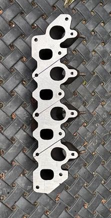 Used replacement exhaust manifold after blanchard grinding (eBay - Italy).