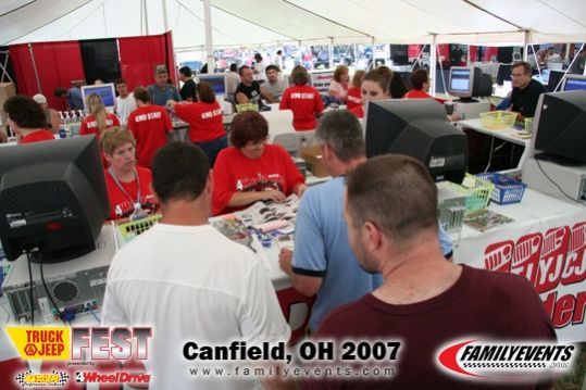 me buying my rims at the jeep fest in canfield ohio, thats me in the upper right corner, with the black t-shirt.