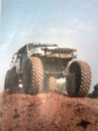 the snipit says   "with what appears to be the big Unimog portal axles, 52-inch michelin XL tires and an otherwise stockish, but obviously well used jeep on top of it, we were really curious about the buil. it's not easy to get those heavey drivetrain parts to stay under a unibody XJ. we never did catch up with the owner of this jeep:after walking through the obstical course like it was a small speed bump, the jeep and owner dissapeared"