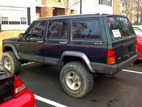 Day i brought it home. worn 32s bfg mt rear and worn 32 bfg at up front. a gutted chevy driveshaft for an exhaust. Sounded like a mac truck. Moulding coming off doors. Clear coat chipping.. a $1200 buy.. came with a D44 rear, tank skid, and xfer case skid. and it has the np242.