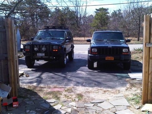My '01 XJ limited, custom 3" lift next to my '00 XJ sport, currently stock but big plans for future :)