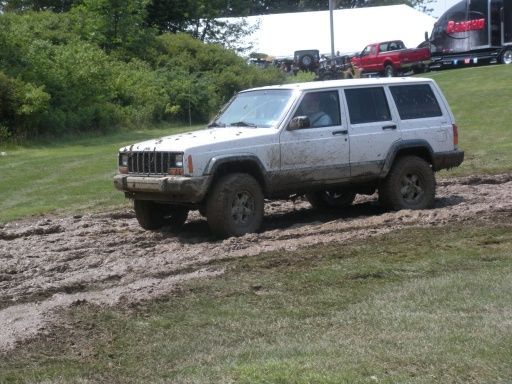 My Jeep driving into the trail by the tree line