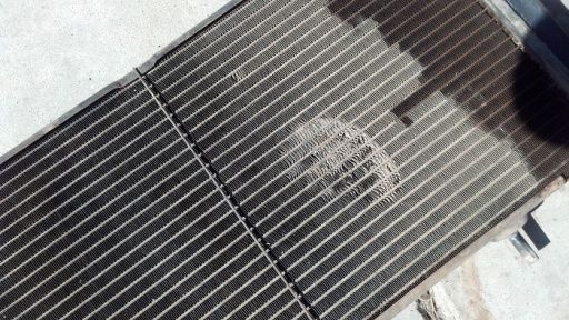 My old radiator...se the spot where the fan impacted the radiator during its little accident?