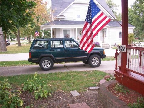 Just after I finished painting the porch, finding the oil leak from heck, and rewelding the flag pole our renters had trashed.  Glad we're living back in that house again.