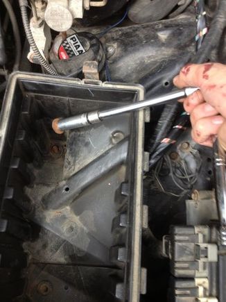 Remove airbox, unless you feel like trying to squeeze a wrench in there.