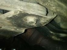 Here’s a closer shot, it has a 21 mm head, a 7/8 will work.
If that’s the bolt proper torque is 74 ft lbs then turn it another 180 degrees. 