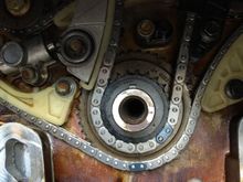Ensured the timing chain was in the correct place , then installed the tensioner and gave it a smack to engage it, That took up all chain slack!