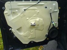A foam plastic panel like this, held in place by black butyl adhesive 