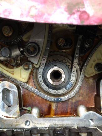 Ensured the timing chain was in the correct place , then installed the tensioner and gave it a smack to engage it, That took up all chain slack!