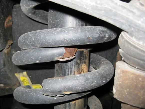 This is a broken front spring in a Chevy Silverado, larger coils but same principle