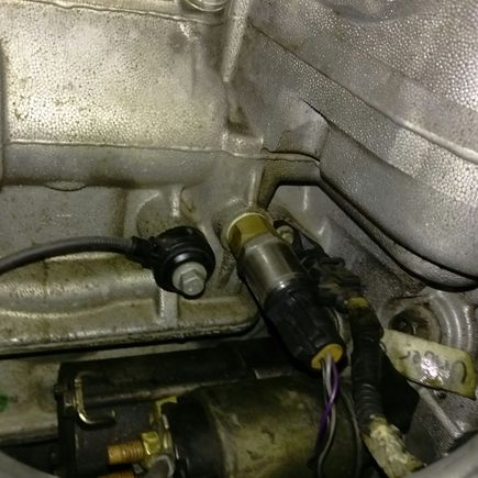 That’s it with the wires connected to it on through the , that’s the starter just below it, and the knock sensor to the right.