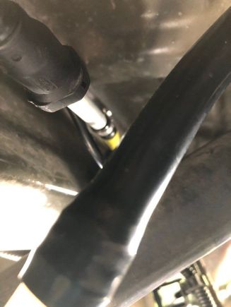 The fuel line to the tank has a female  quick connect fitting 
It appears in your photo that piece is missing where the gear clamp is. Dorman has those available to replace that 3/8 connection 