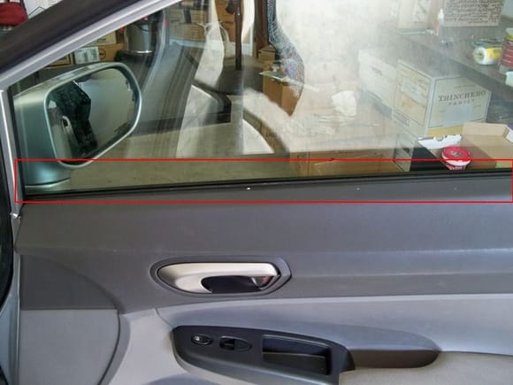 rubber/felt against the inside of passenger window.