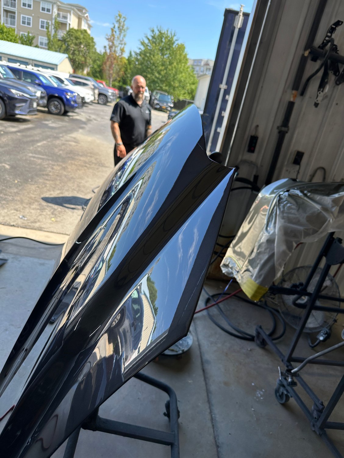 New IS500 hood just after new Cloudburst Gray paint.  Hood is being wet-sanded and buffed.