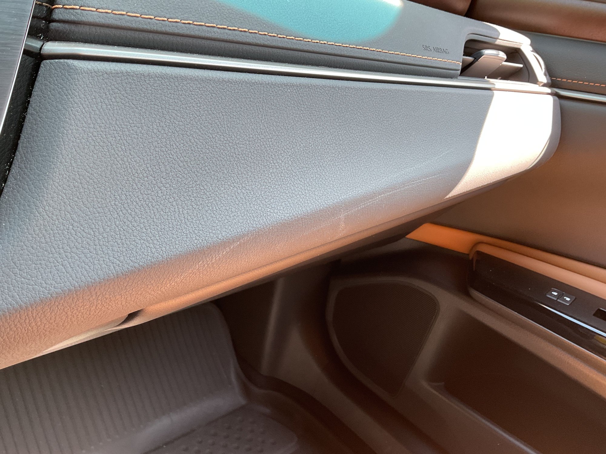 Area right above glove compartment.