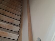 Hand rail installed in stairwell.