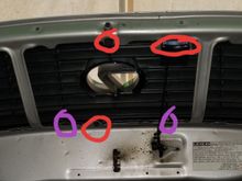 The bolts are in red the screws are in purple undo all the bolts circled and the grill comes out then you have to unscrew the screws in purple to get the insert out there is probably more screws I forgot about but its super simple to do.