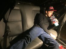 16 year old son showing how roomy the back seats are.