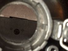 Another closer look (metal tab clearly placed higher than cutoff shield and the screw I was talking about)