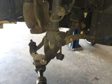 The two caliper bolts were removed and the caliper was hung out of the way using zip ties.
The upper control arm was removed from the spindle along with the lower and the spindle was set aside.