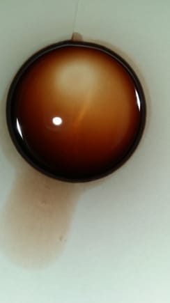 This is the color of my fluid, it looks darker in person, but it doesn't smell burnt or anything at least to me it don't.