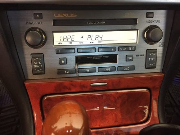 Mount the cassette adapter, run wire thru the astray.  Close the radio door, you hide everything.