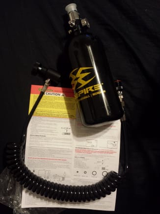 48 cubic in.,  3,000 psi HPA (High Pressure Air) nitrogen/ compressed air tank with pressure regulated hose. Used for paintball. both parts new cost ~45$ from ebay.com .This will be used for the future recharging of my shocks. A local air compressor shop quoted me $20 to fill this tank. Considering a shock is only charged to 150 - 300psi max, and has a small area for gas internally, this should last me a long time.