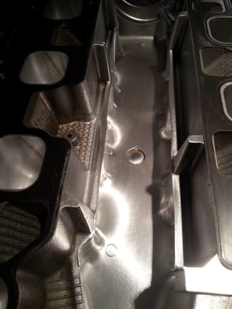 Lower valley of intake manifold...casting roughness and flashing removed.