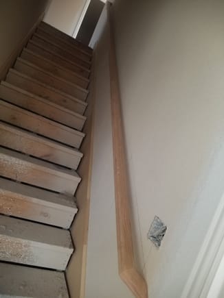 Hand rail installed in stairwell.