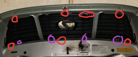 The bolts are in red the screws are in purple undo all the bolts circled and the grill comes out then you have to unscrew the screws in purple to get the insert out there is probably more screws I forgot about but its super simple to do.