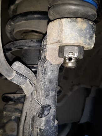Here is the Moog upper control arm with their supplied nut  installed.

This is inot only improper nut style, it is unsafe.
Supply chain partner Rock Auto has a duty to moniter what they sell. 