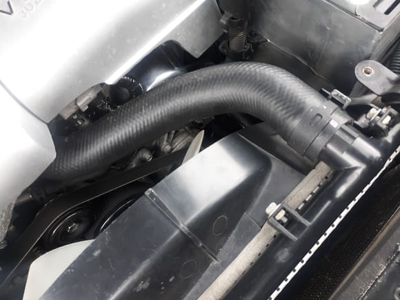 LS430 hose eliminates two 90 degree bend for two 45 degree bends. More than adequate clearance(s) without need for  using a spacer between fan bracket pulley and fan clutch to move fan blades forward. 

