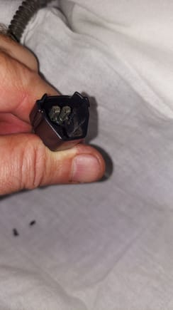 With the connector in 2 pieces the 2 black pin keepers fell out.  They may have been broken. Which would explain the difficulty releasing the pins.  3 more to go.