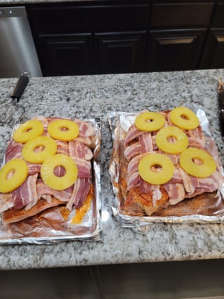 Marinated for 36 hrs in mango peach juice, injected with mango/peach/pineapple/beer, topped with KosmosQ Killer HoneyBee rub, braided bacon, smokehouse rub, then pineapple slices and drizzled in pineapple juice.

