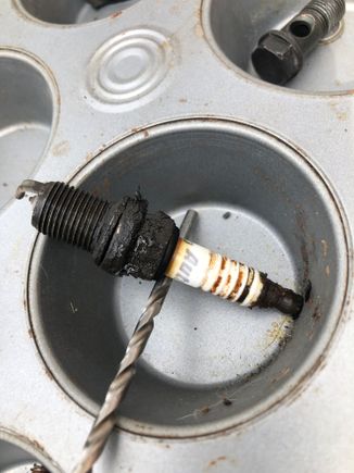 One of The spark plugs covered in carbonization 